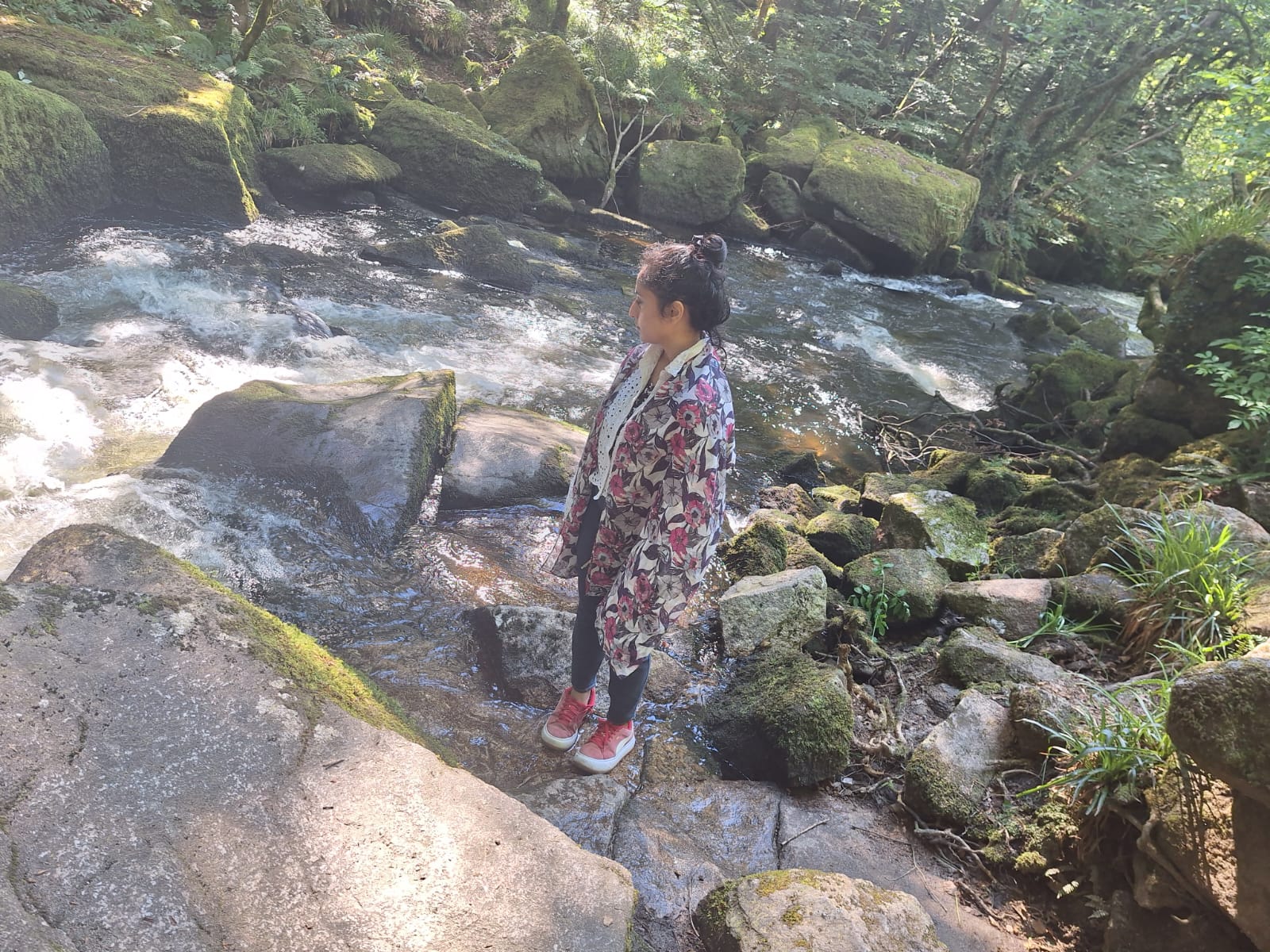 A retreat guest exploring Golitha Falls